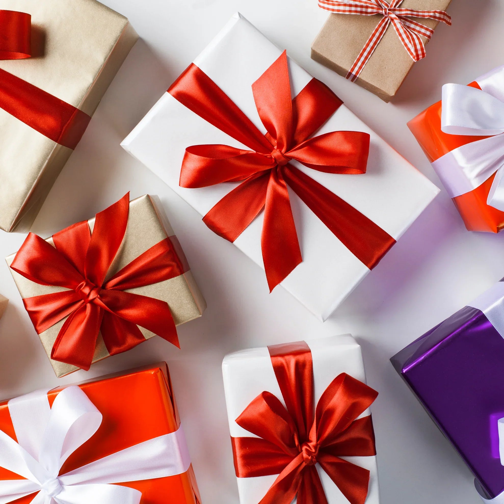 Assorted gift boxes with colorful ribbons, perfect for holiday presents or special occasions