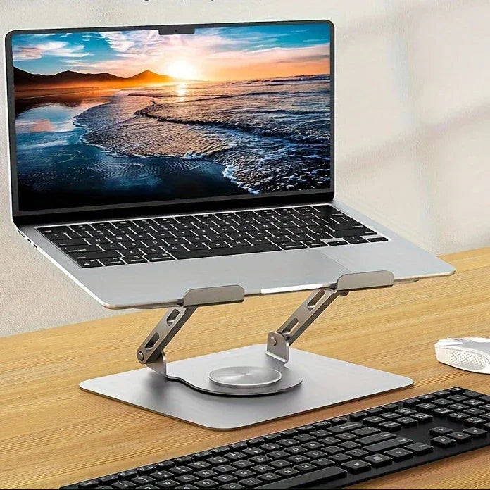 Adjustable aluminum laptop stand holding laptop on wooden desk with keyboard and mouse